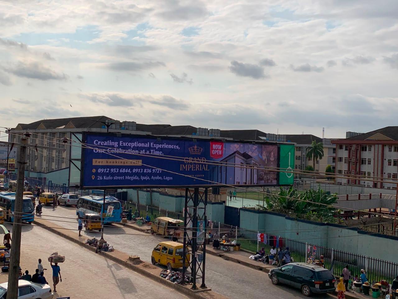 Grand Imperial billboard on Kufo Street, Megida