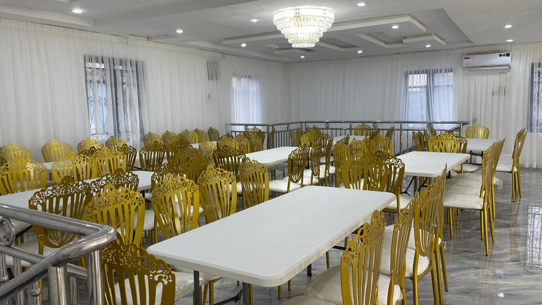 Balcony level seating with ornate gold chairs