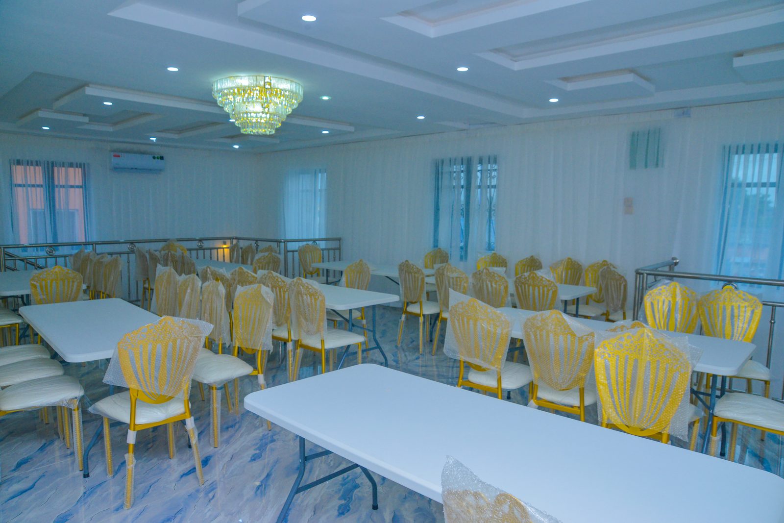 Long tables laid for a formal dinner